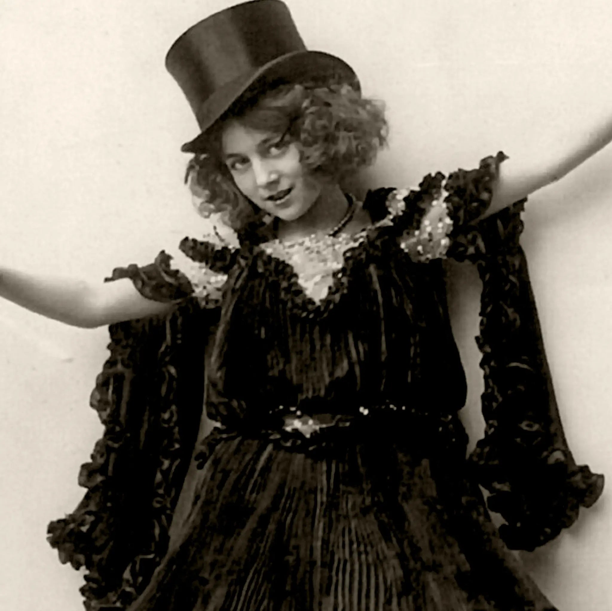Close-up detail of theatrical performer showing elaborate costume and graceful balancing pose on champagne bottle
