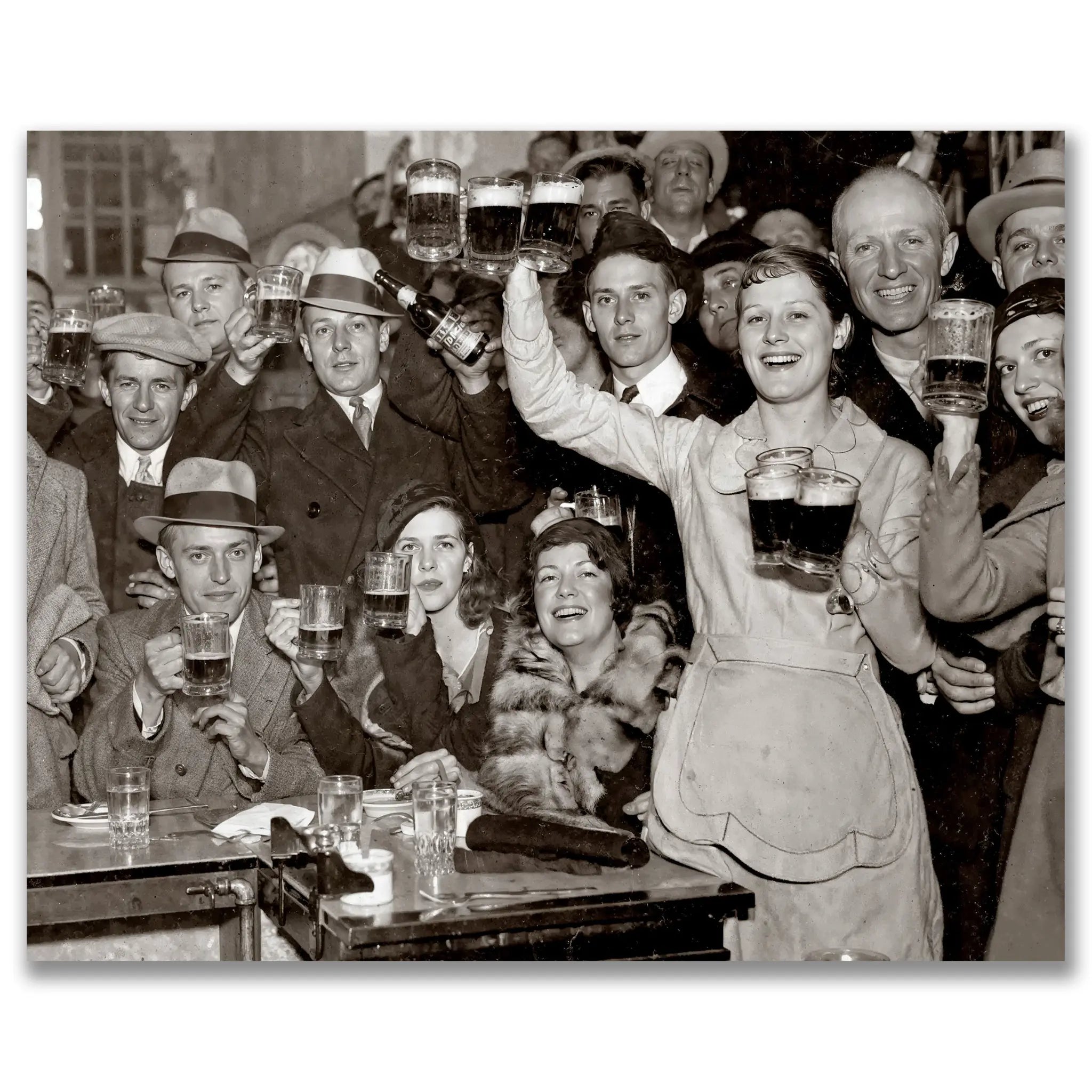 Historic prohibition era beer hall celebration photograph showing crowd with raised beer mugs toasting the return of legal brewing