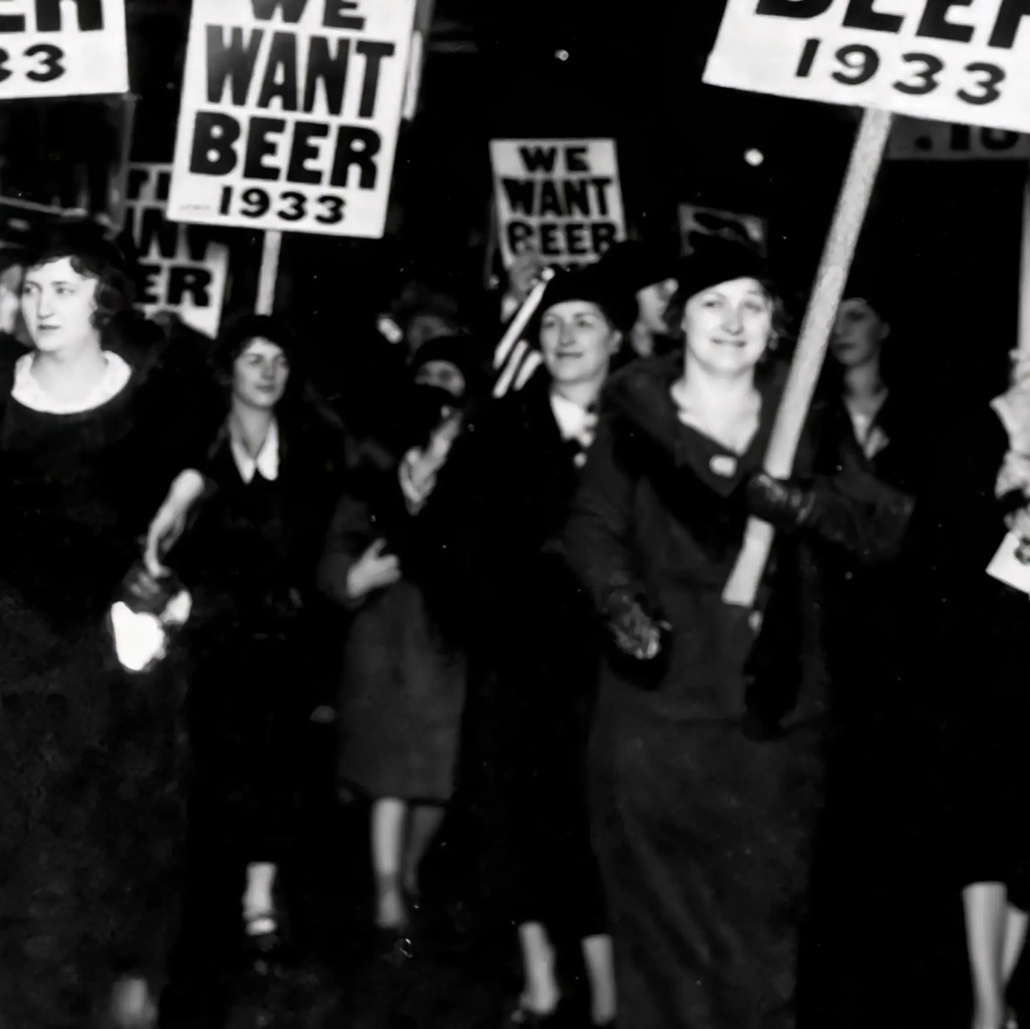 Close-up detail of women protesters showing determined faces and clear WE WANT BEER 1933 messaging during historic female demonstration
