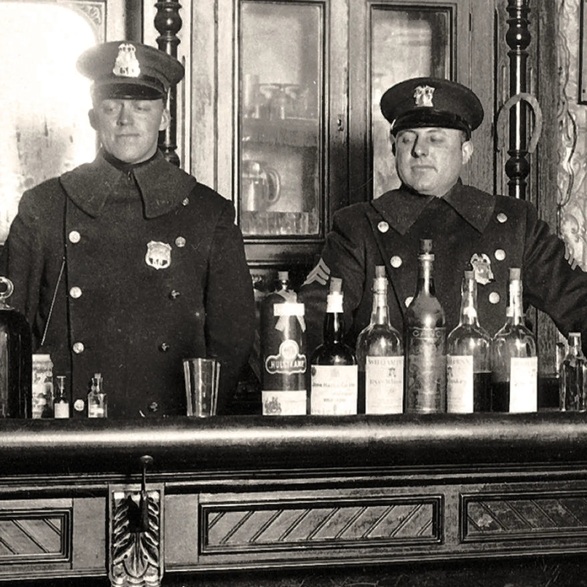 Close-up detail of prohibition police officers showing uniformed law enforcement with badges and confiscated alcohol bottles on ornate bar