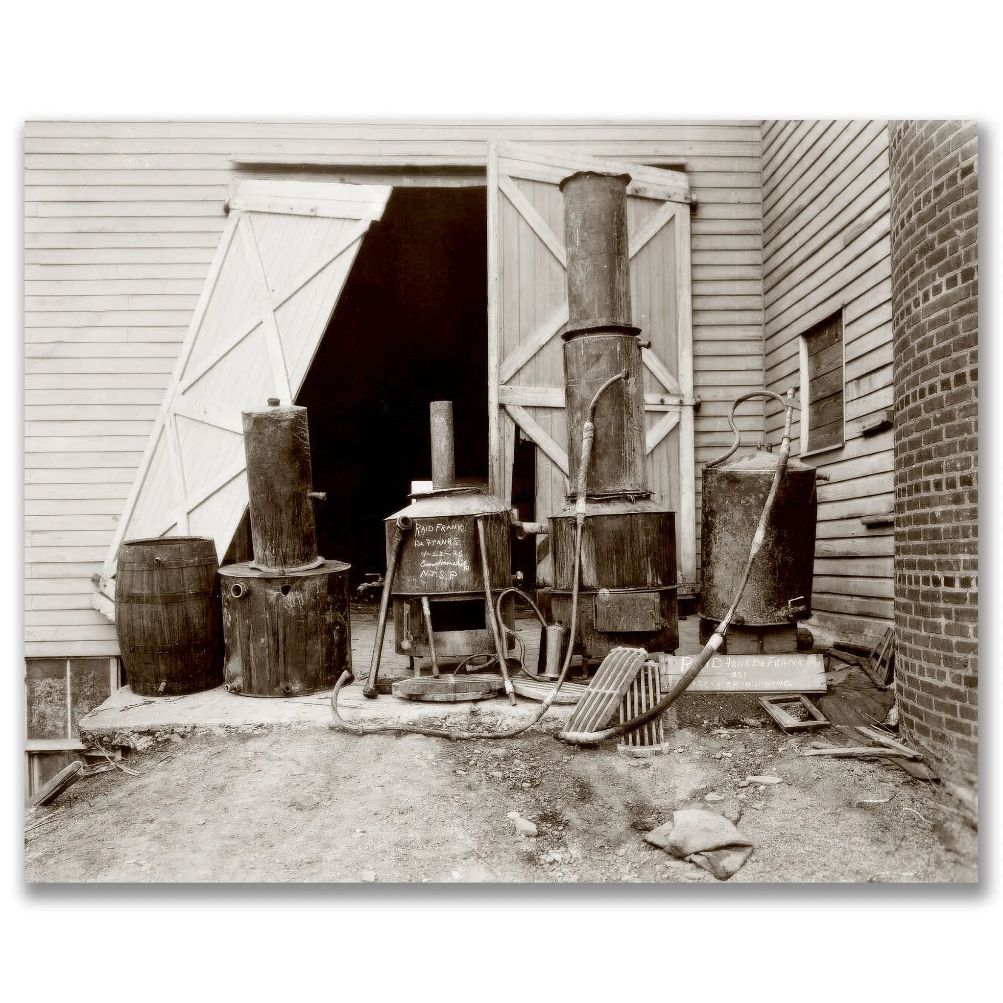 Historic prohibition era moonshine still operation showing copper stills and distillation equipment in rural barn setting