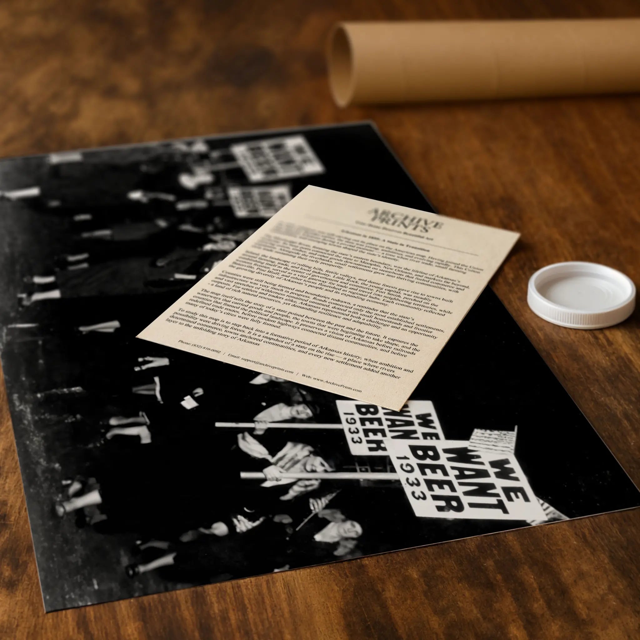 Professional packaging for women's protest photograph with tube and historical documentation materials